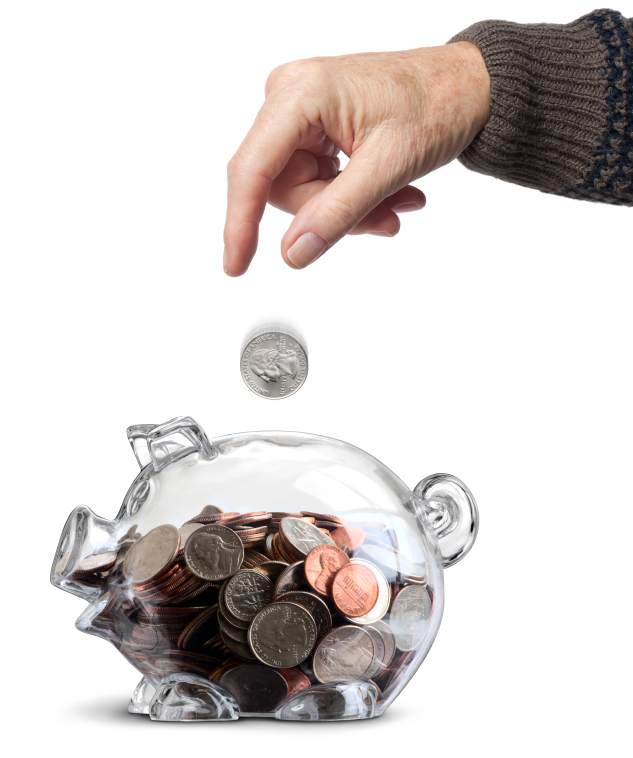 Elderly hand dropping a coin into a clear piggy bank nearly filled with coins isolated over white with a clipping path and shadow